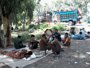 Afghan Refugees waiting outside the Voluntary Repatriation Centre: Photo by News Lens Pakistan/